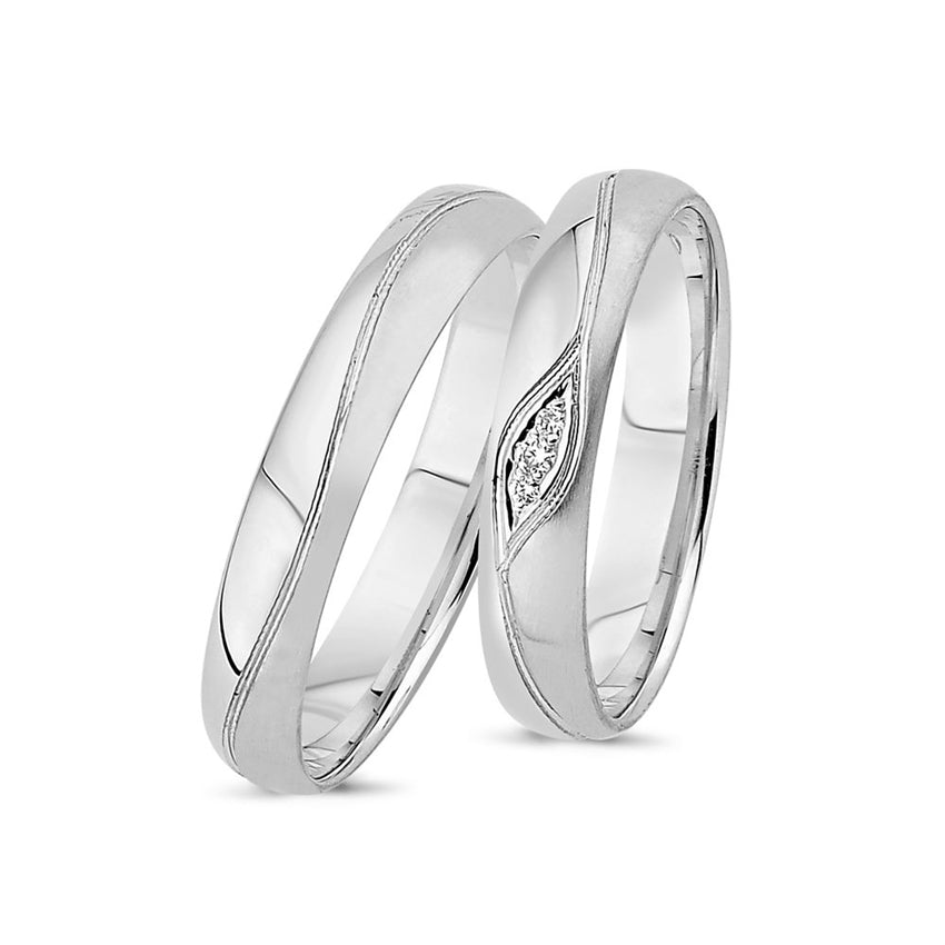 Eksklusive Nuran vielsesringe i 14 kt hvidguld med 0,04 ct diamanter og båndgravering.